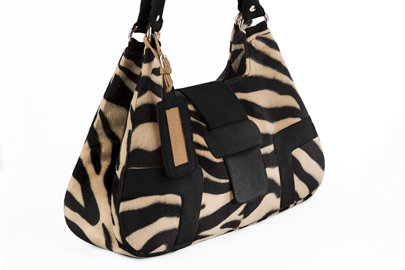 Handcrafted women's luxurious elegant handbag in animal print and matt black. Perfect for elevated everyday style.   
                Choose from our luxurious collections of leather and fabric to perfectly match your handbags to your outfits.